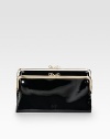 Much more room inside than you'd expect in a clutch, with a high-shine finish in gorgeous patent leather.Kiss-lock closure One inside zip pocket, two bill slots, six credit card slots Fully lined 8½W X 5H X 1D Imported