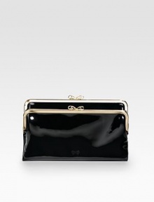 Much more room inside than you'd expect in a clutch, with a high-shine finish in gorgeous patent leather.Kiss-lock closure One inside zip pocket, two bill slots, six credit card slots Fully lined 8½W X 5H X 1D Imported Much more room inside than you'd expect in a clutch, with a high-shine finish in gorgeous patent leather.Kiss-lock closure One inside zip pocket, two bill slots, six credit card slots Fully lined 8½W X 5H X 1D Imported