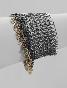A wide, bold design with an urban attitude, in a tricolor metal mix with dangling fringe chains.BrassLength, about 7½Magnetic claspImported A wide, bold design with an urban attitude, in a tricolor metal mix with dangling fringe chains.BrassLength, about 7½Magnetic claspImported