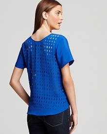 Perforation at the sides and back of this Aqua top lend downtown cool to the vibrant style for a modern update to weekend hours.