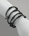 Carolee black faceted jet beaded bracelet is ideal for a stroll around the avenue or a night out. Four rows. Slips on and off with no closure.