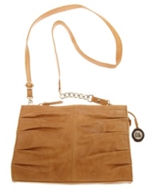 An uptown design with downtown detailing. This polished look from The Sak features a classic shoulder bag shape with pretty pleating. A chain detailed strap and signature charm add just the right amount of edge. An uptown design with downtown detailing. This polished look from The Sak features a classic shoulder bag shape with pretty pleating. A chain detailed strap and signature charm add just the right amount of edge.