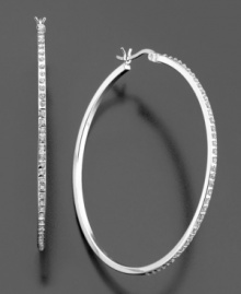 These slender hoops add the perfect touch of subtle glamour to your look. Featuring diamond accents set in sterling silver. Approximate diameter: 1-3/4 inches. These slender hoops add the perfect touch of subtle glamour to your look. Featuring diamond accents set in sterling silver. Approximate diameter: 1-3/4 inches.