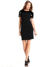MICHAEL Michael Kors' little black dress shimmers with striking sequined detail at the shoulders. MICHAEL Michael Kors' little black dress shimmers with striking sequined detail at the shoulders.