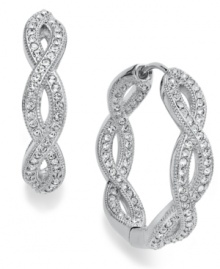 Get in the mix. Eliot Danori's traditional hoop earrings take an unexpected twist with an intertwining design embellished with crystal accents. Set in rhodium-plated silver tone mixed metal. Approximate diameter: 1 inch. Get in the mix. Eliot Danori's traditional hoop earrings take an unexpected twist with an intertwining design embellished with crystal accents. Set in rhodium-plated silver tone mixed metal. Approximate diameter: 1 inch.