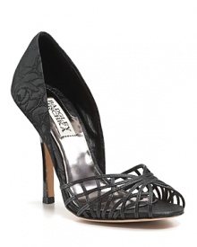 An intricate cage of woven leather provides elegant contrast to classic brocade on these shapely sandals from Badgley Mischka. An intricate cage of woven leather provides elegant contrast to classic brocade on these shapely sandals from Badgley Mischka.