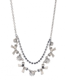 Get frilly and flirtatious in Betsey Johnson's chic frontal necklace. Crafted in silver tone mixed metal, featuring two tiers of Czech crystals, ribbons and glass stones. Approximate length: 15 inches + 3-inch extender. Approximate drop: 3 inches. Get frilly and flirtatious in Betsey Johnson's chic frontal necklace. Crafted in silver tone mixed metal, featuring two tiers of Czech crystals, ribbons and glass stones. Approximate length: 15 inches + 3-inch extender. Approximate drop: 3 inches.