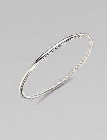 From the Bangle Collection. A single bangle of sterling silver, smooth on the outside and cabled on the inside, to wear alone or with others. Sterling silver Width, about ¼ Diameter, about 2½ Imported 