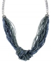 Calm down in cool hues. Jessica Simpson's chic knotted necklace combines multiple strands of acrylic beads in a palette of pale blue and grey. Set in silver tone mixed metal. Approximate length: 17 inches.