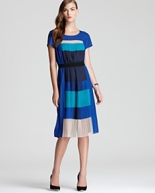 Pretty pleats adopt a color blocked look on BCBGMAXAZRIA's cool blue frock.