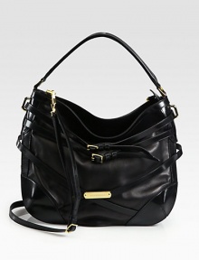Buttery soft lambskin design in a slouchy shape with belted strap detail.Top handle, 7 dropDetachable, adjustable shoulder strap, 23-26 dropTop zip closureOne inside zip pocket and two inside open pocketsNylon lining15W X 11½H X 6DMade in Italy Buttery soft lambskin design in a slouchy shape with belted strap detail.Top handle, 7 dropDetachable, adjustable shoulder strap, 23-26 dropTop zip closureOne inside zip pocket and two inside open pocketsNylon lining15W X 11½H X 6DMade in Italy
