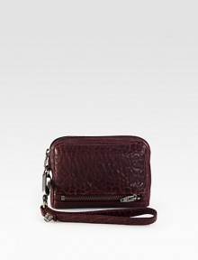 A beautifully textured style with a wrist strap for hands-free convenience.Wrist strap, 6½ dropTop zip closureOne outside zip pocketFour credit card slotsTwo inner compartmentsFully lined4½W X 6¼H X 1½DImported A beautifully textured style with a wrist strap for hands-free convenience.Wrist strap, 6½ dropTop zip closureOne outside zip pocketFour credit card slotsTwo inner compartmentsFully lined4½W X 6¼H X 1½DImported