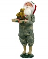 Singing their praises, Santa Claus honors military families in a camouflage suit and iconic red hat. In his arms are extra-special gifts piled high and topped with an adorable stuffed bear. An all-American figurine, handcrafted by Byers' Choice.