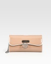 Signature flap-front bag crafted from sleek patent leather and finished with a logo medallion.Removable shoulder strap, 9½ dropFlap-front closure with slotOne inside zip pocketSignature red lining10¼W X 5¼H X 2¼DMade in Italy