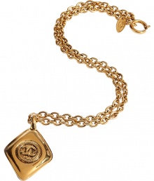 Ultra-luxe golden 1980s diamond shaped necklace - This statement-making necklace is authentic vintage Chanel from the 1980s - Stylish gold-plated chain necklace with iconic double C Chanel logo charm - Amp up any outfit with this ultra-chic accessory- Perfect for cocktail attire or to dress up daywear Ultra-luxe golden 1980s diamond shaped necklace - This statement-making necklace is authentic vintage Chanel from the 1980s - Stylish gold-plated chain necklace with iconic double C Chanel logo charm - Amp up any outfit with this ultra-chic accessory- Perfect for cocktail attire or to dress up daywear