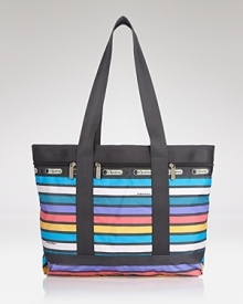 LeSportsac's signature nylon tote boasts bold stripes and ample space for must-haves. The color-clad bag escorts you on weekend errands or jet-setting adventures in stylish sensibility. LeSportsac's signature nylon tote boasts bold stripes and ample space for must-haves. The color-clad bag escorts you on weekend errands or jet-setting adventures in stylish sensibility.