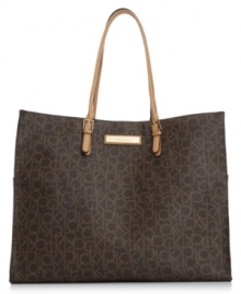 Standout in signature style with this take-anywhere tote from Calvin Klein, featuring the iconic CK monogram. Soft leather trim, gleaming hardware and spacious interior make this silhouette an every season essential. Standout in signature style with this take-anywhere tote from Calvin Klein, featuring the iconic CK monogram. Soft leather trim, gleaming hardware and spacious interior make this silhouette an every season essential.