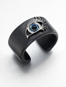 From the Envy Collection. The eyes have it in this striking cuff of jet black resin, dramatically adorned with a sweeping silver-outlined eye that gazes and glitters intently, set with cubic zirconia and black onyx.Black onyxBlack, white and blue cubic zirconiaSterling silverResinDiameter, about 2.25Imported