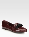 A dimensional grosgrain ribbon bow tops this must-have favorite, crafted of reflective patent leather. Patent leather upper with grosgrain ribbon bowLeather lining and solePadded insoleImported