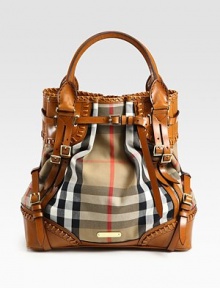 Gorgeous whip-stitched leather pairs with signature check canvas in this slouchy top-handle carryall.Double top handles, 6 dropMagnetic top closureOutside buckled strapsProtective metal feetCenter zip compartmentOne inside zip pocketFully lined13½W X 14HMade in Italy