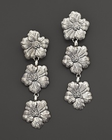 Delicate gardenias, captured at the height of their beauty in sterling silver, bloom on these earrings from Buccellati.