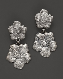 Delicate gardenias, captured at the height of their beauty in sterling silver, bloom on these earrings from Buccellati.