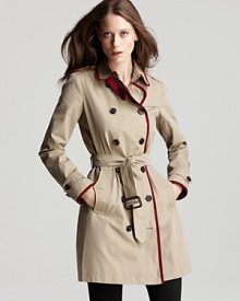 Burberry Brit trims the classic trench in vibrant red, updating the timeless, must-have style with modern details. Pair this staple with a monochromatic look underneath for a forward look.