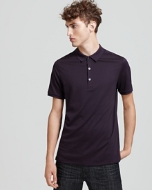 Check print accents the inner placket of Burberry Brit's classic polo shirt. Check print accents the inner placket of Burberry Brit's classic polo shirt.