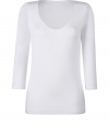 Stylish T-shirt in white stretch rayon - very soft and pleasant quality - low scoop neck - sleeves in discreet 3/4 length, ideal for women who dont like to reveal their arms or wear the top at the office - slim and slightly waist fitted - new basic - feminine and comfortable alternative for a blouse - wear with a pant suit, pleated skirt, cardigan