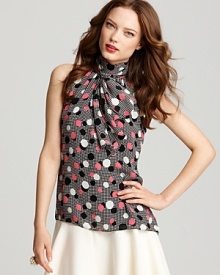 With vintage-chic inspiration in an eye-popping polka dot print, this sleeveless silk Milly top features a high collar finished with an oversized tie scarf and a just-right drape.