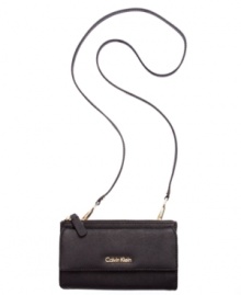 Classic styling with modern versatility, this Saffiano leather lovely from Calvin Klein converts from a casual crossbody to elegant evening bag in just two clicks. Outfitted with signature hardware and detailed stitching, it's the perfect day-to-night design. Classic styling with modern versatility, this Saffiano leather lovely from Calvin Klein converts from a casual crossbody to elegant evening bag in just two clicks. Outfitted with signature hardware and detailed stitching, it's the perfect day-to-night design.