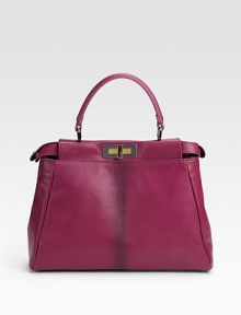 Sumptuous goatskin and calfskin with a structured silhouette, features a center stripe and signature logo lining.Top handle, 4½ drop Adjustable shoulder strap, 15-26 drop Turnlock closure Protective metal feet One inside zip pocket Fully lined 13W X 10H X 4D Made in Italy Sumptuous goatskin and calfskin with a structured silhouette, features a center stripe and signature logo lining.Top handle, 4½ drop Adjustable shoulder strap, 15-26 drop Turnlock closure Protective metal feet One inside zip pocket Fully lined 13W X 10H X 4D Made in Italy