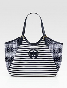 A fun mixed-print style in lightweight nylon with luxurious leather trim.Double adjustable leather top handles, 7-9 dropMagnetic snap closureOne inside zip pocketTwo inside open pocketsCotton lining13W X 12H X 5DImported A fun mixed-print style in lightweight nylon with luxurious leather trim.Double adjustable leather top handles, 7-9 dropMagnetic snap closureOne inside zip pocketTwo inside open pocketsCotton lining13W X 12H X 5DImported
