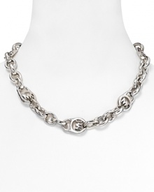 MICHAEL Michael Kors' logo-embossed chain adds a stroke of silver polish to daytime looks. Layer the showpiece over everything from graphic prints to a simple white tee.