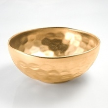 Michael Wainwright has created elegant porcelain since 1991. Each piece is made of porcelain and fired in a kiln at least three times. First, the rims are cut by hand, so that no two pieces are exactly alike. Second, the wares are glazed by hand and fired to nearly 2200 degrees F., 22-karat gold or platinum is hand painted on each piece and fired in a kiln one more time, resulting in a finish that is dishwasher-safe. Michael Wainwright has created elegant porcelain since 1991. Each piece is made of porcelain and fired in a kiln at least three times. First, the rims are cut by hand, so that no two pieces are exactly alike. Second, the wares are glazed by hand and fired to nearly 2200 degrees F., 22-karat gold or platinum is hand painted on each piece and fired in a kiln one more time, resulting in a finish that is dishwasher-safe.
