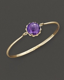 A faceted amethyst adds brilliant color to gleaming 18K yellow gold. By Carelle.