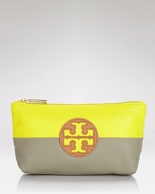 Tory Burch pops and blocks it with this top zip cosmetics case, accented by a bold logo and contrasting neon and neutral hues. It's a bold way to bag your beauty products. Tory Burch pops and blocks it with this top zip cosmetics case, accented by a bold logo and contrasting neon and neutral hues. It's a bold way to bag your beauty products.