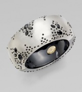 A wide, smooth, gleaming bangle of hand-sculpted, hand-painted Lucite is elegantly sprinkled with black Swarovski crystals and little silvery beads.LuciteCrystalDiameter, about 2¼Width, about 1¼Hinged, with magnetic claspMade in USA