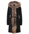 Ultra luxurious and equally cozy, Parajumpers fur trimmed shearling coat is a smart investment for multi-season sporty sophistication - Raccoon trimmed hood with rabbit fur lining, long sleeves, shoulder logo patch, hidden front closures, oversized snapped pockets, self-tie sash, belt loops, zippered side slits at hemline - Feminine tailored fit falls to the thigh - Team with skinnies and chic winter boots