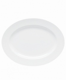 Dine with Wickford dinnerware and tie in timeless sophistication with every meal. This versatile white porcelain oval platter has a contemporary shape embossed with a twisting rope design. Dine with Wickford dinnerware and tie in timeless sophistication with every meal. This versatile white porcelain oval platter has a contemporary shape embossed with a twisting rope design.