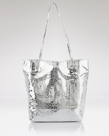 Carlos Falchi's tote is a luxe take on a classic shape. In metallic micro-fiber with an interior pouch, this style strikes an enviable balance between practicality and polish. Carlos Falchi's tote is a luxe take on a classic shape. In metallic micro-fiber with an interior pouch, this style strikes an enviable balance between practicality and polish.