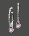 Pink crystal hearts dangle from gleaming sterling silver hoops. By Judith Ripka.