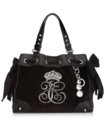 If you dream in couture, this iconic design from Juicy Couture will make every day sweeter. Charming grosgrain bows, shiny silver-tone hardware and rhinestone logo and crown adorn the silhouette, while pockets inside and out organize your essentials. If you dream in couture, this iconic design from Juicy Couture will make every day sweeter. Charming grosgrain bows, shiny silver-tone hardware and rhinestone logo and crown adorn the silhouette, while pockets inside and out organize your essentials.
