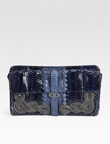 A stunning style in bold, two-tone cobra skin accented with beautiful knot motifs.Magnetic top closureTwo outside snap strap flap pocketsSuede lining12W X 6H X 1¼DMade in Italy A stunning style in bold, two-tone cobra skin accented with beautiful knot motifs.Magnetic top closureTwo outside snap strap flap pocketsSuede lining12W X 6H X 1¼DMade in Italy