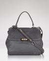 Explore ladylike territory with MARC BY MARC JACOBS top handle satchel. Roomy yet refined, this leather bag gives fall's loud prints and vibrant hues an urbane hit.