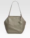 Sumptuous leather intricately woven in a roomy top handle carryall.Double top handles, 10½ dropTop zip closureOne inside zip pocketOne inside open pocketSuede lining17W X 10¾H X 9½DMade in Italy