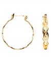 Versatile hoop earrings with a touch of exotic openwork, by Monet. Crafted in goldtone mixed metal. Approximate diameter: 1 inch.