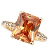 Feel like royalty every time you wear this luscious, caramel-colored ring. Design by City by City features an emerald-cut cubic zirconia (7-1/2 ct. t.w.) with sparkling accents at the shoulders. Crafted in gold tone mixed metal. Sizes 7 and 8.