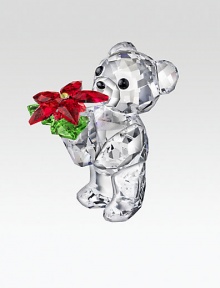 This year's Kris Bear is long on sparkle, richly faceted with the sweetest face, offering a colorful poinsettia plant as a holiday greeting.CrystalAbout 1.5H X 1WMade in Austria This year's Kris Bear is long on sparkle, richly faceted with the sweetest face, offering a colorful poinsettia plant as a holiday greeting.CrystalAbout 1.5H X 1WMade in Austria