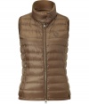 Lightweight and stylish, this quilted down Vest will keep you looking chic from season-to-season - Stand collar with snap detail, front zip closure, zip pockets, all-over quilt detail - Pair with jeans, wide leg trousers, or a mini-dress with ribbed tights